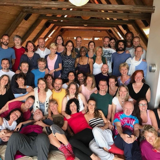 A retreat group gathered in a warm timber room